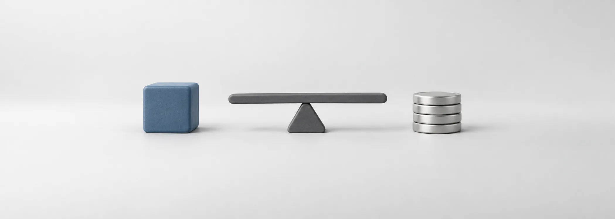 A steel-blue block, graphite balance beam and silver coins represent the different weights in an investment portfolio.