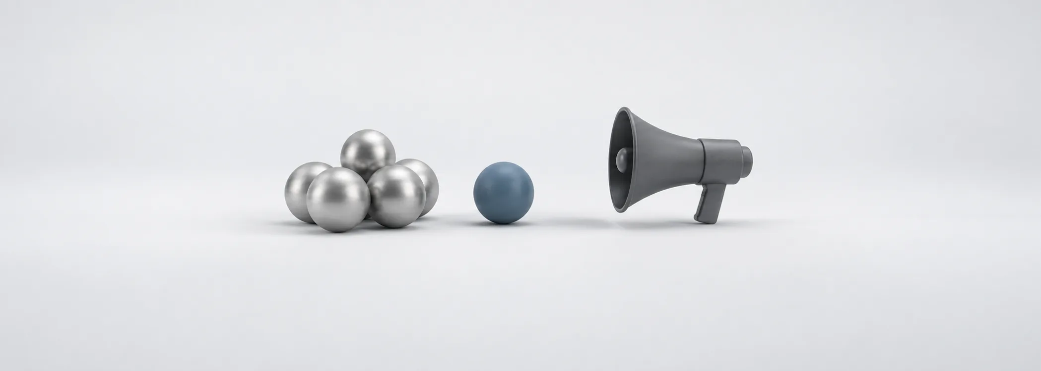 Silver spheres cluster near a graphite megaphone while one steel-blue sphere stands apart, suggesting crowd pressure.