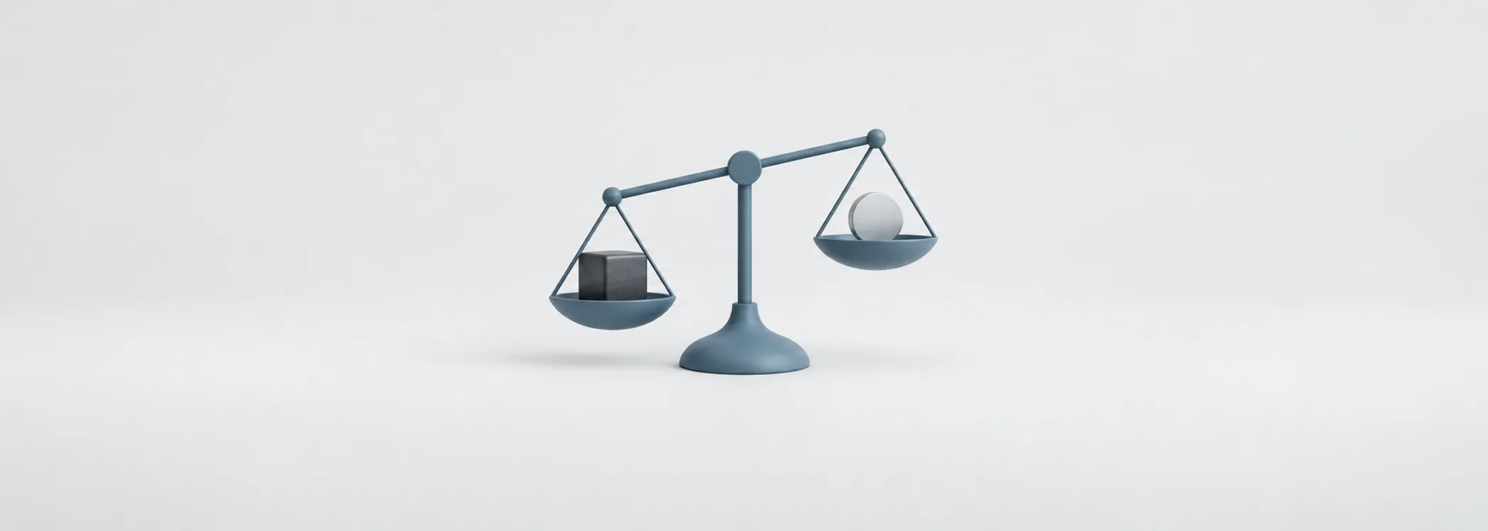 A steel-blue balance scale tilts toward a graphite cube, outweighing a silver coin and suggesting losses loom larger.