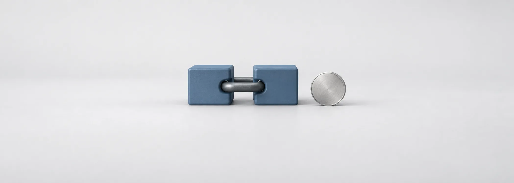 Two steel-blue company blocks joined by a graphite ring beside a silver coin, representing a business acquisition.